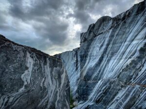 A mountain ridge under a cloudy sky.