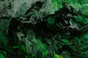 Different shades of green swirl around.